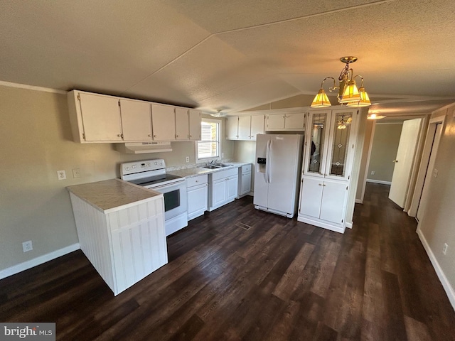 kitchen with lofted ceiling, under cabinet range hood, white appliances, white cabinetry, and dark wood-style floors