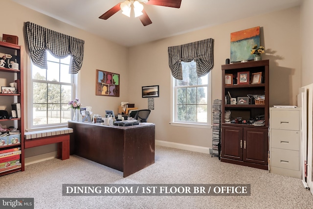 office area featuring ceiling fan, carpet, a wealth of natural light, and baseboards