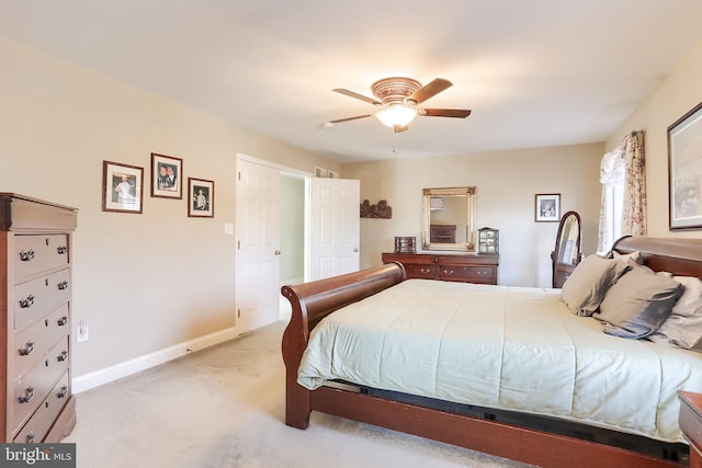 bedroom featuring carpet, a ceiling fan, and baseboards