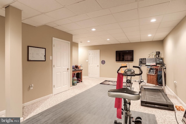 workout room with a drop ceiling, recessed lighting, and baseboards