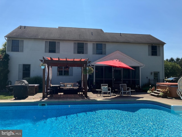 outdoor pool featuring outdoor lounge area, a patio, a hot tub, and a pergola