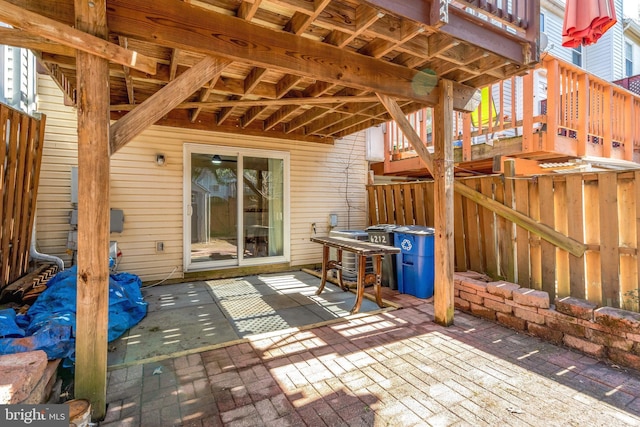 view of patio featuring fence