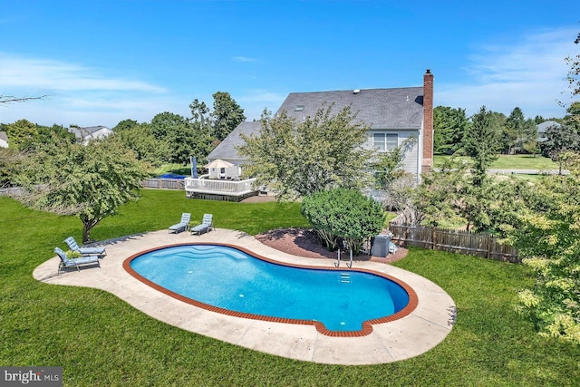 view of swimming pool with a fenced in pool, a lawn, a patio, and fence