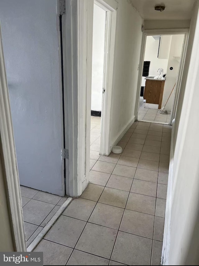 hallway with light tile patterned flooring