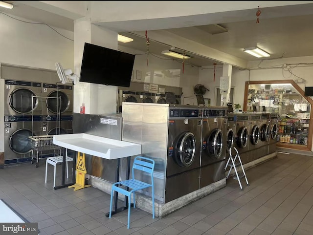 interior space with stacked washer and clothes dryer and washer and dryer