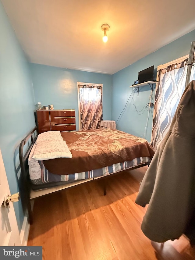 bedroom with wood finished floors