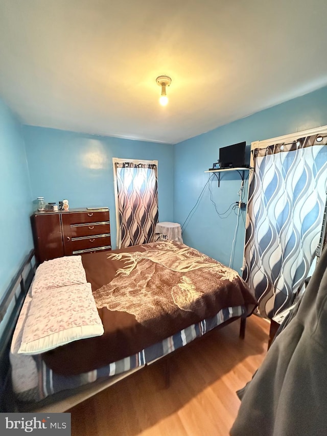 bedroom with wood finished floors