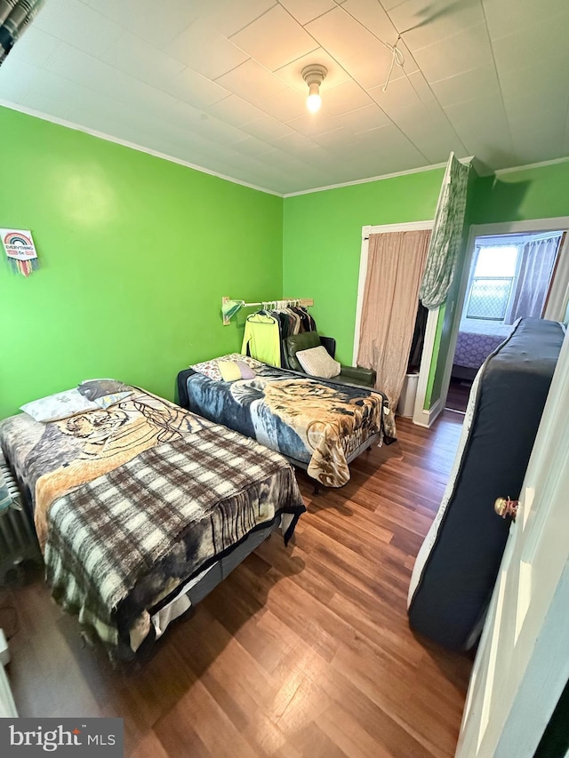 bedroom with wood finished floors