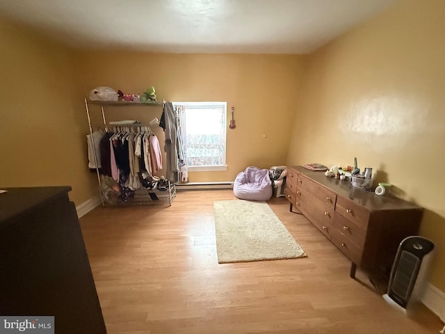 interior space featuring light wood-type flooring and baseboards