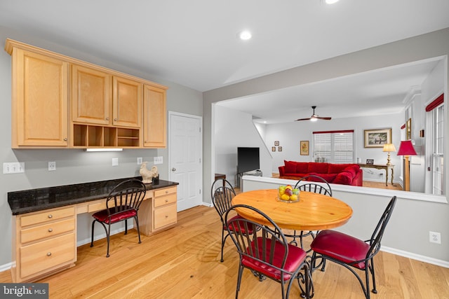 dining room featuring light wood-style flooring, recessed lighting, a ceiling fan, baseboards, and built in desk