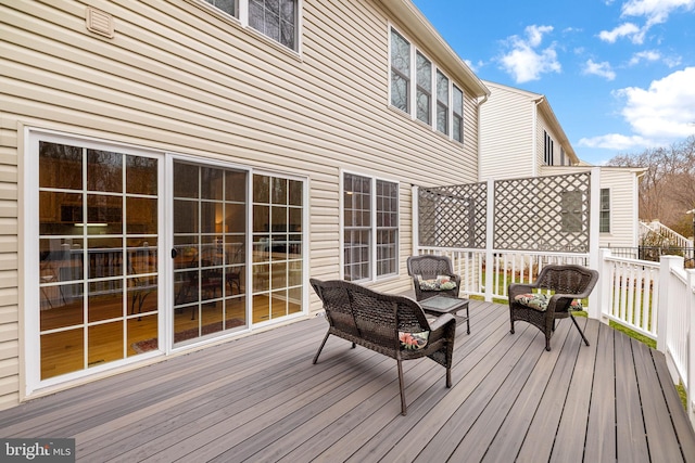 wooden deck with outdoor lounge area