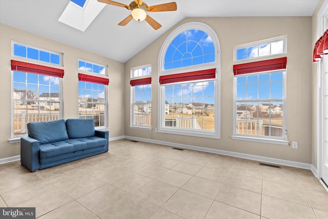 interior space with a skylight, tile patterned flooring, and visible vents