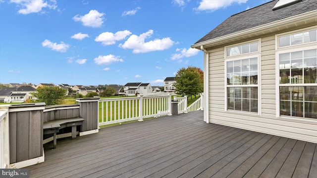 wooden deck featuring a residential view