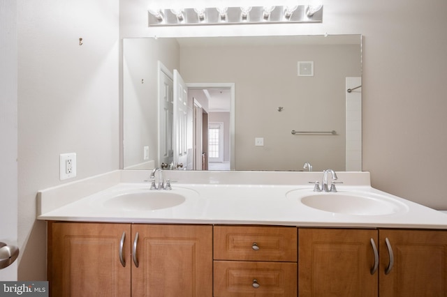 bathroom with double vanity and a sink