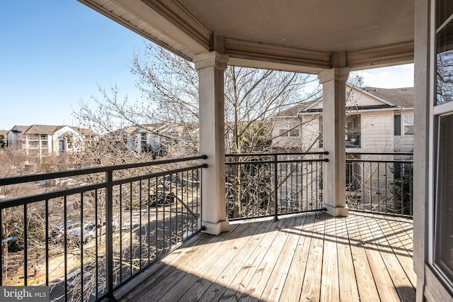 wooden terrace featuring a residential view