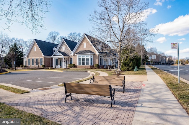 view of property's community featuring uncovered parking