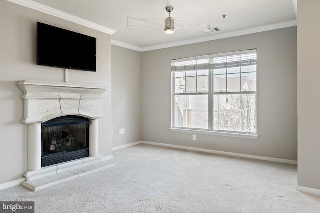 unfurnished living room featuring plenty of natural light, carpet, baseboards, and ornamental molding