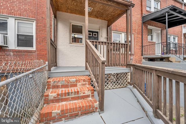 doorway to property with brick siding