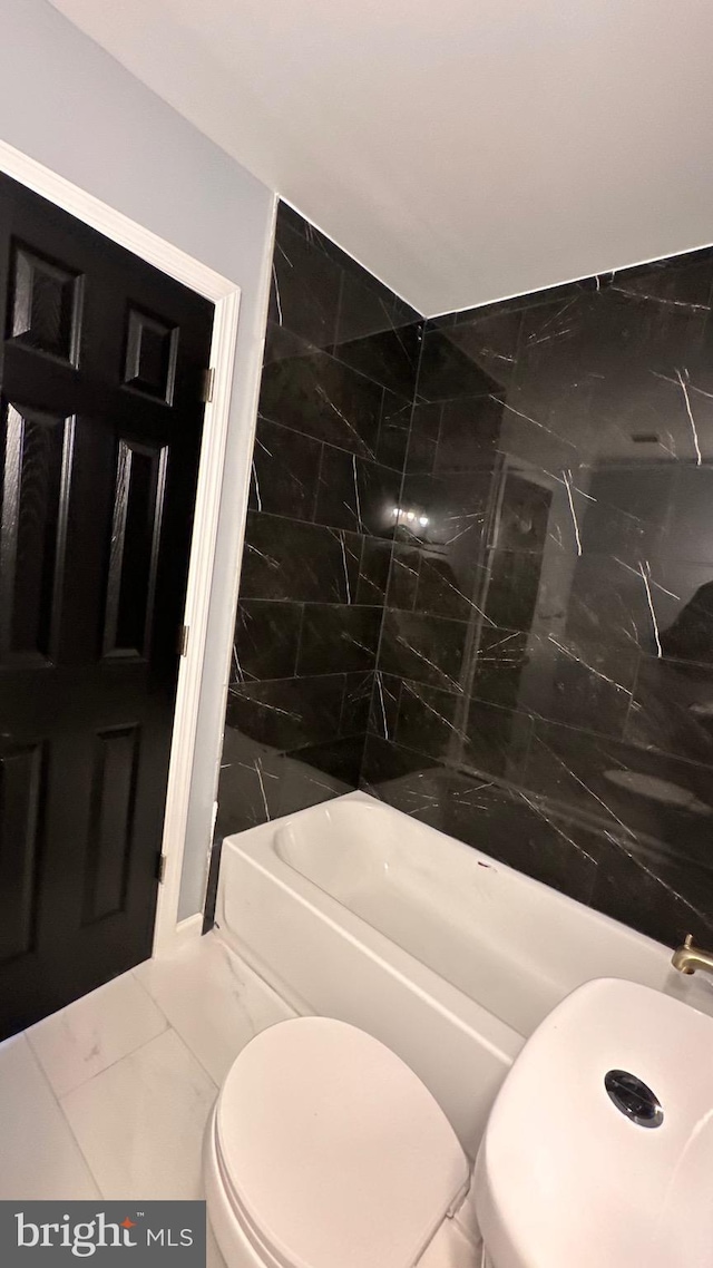 full bath featuring shower / bathtub combination, marble finish floor, and toilet