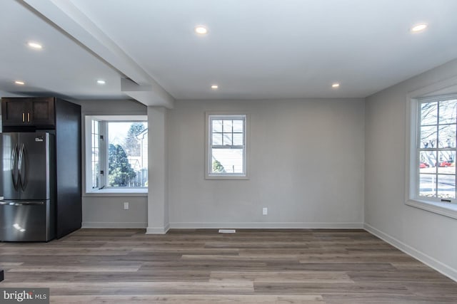 interior space with light wood-style flooring, baseboards, and recessed lighting