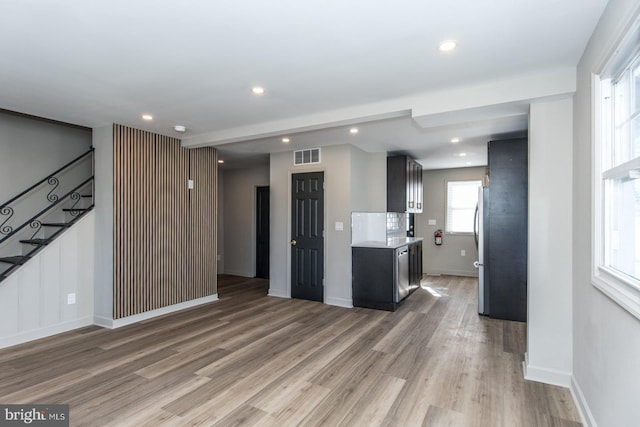 kitchen featuring freestanding refrigerator, light wood finished floors, visible vents, and recessed lighting