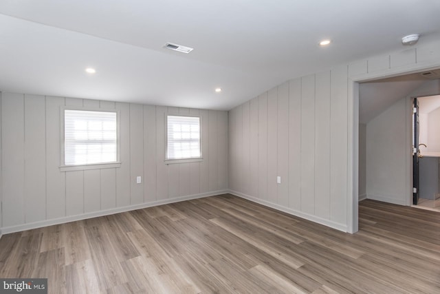 empty room with recessed lighting, visible vents, and wood finished floors