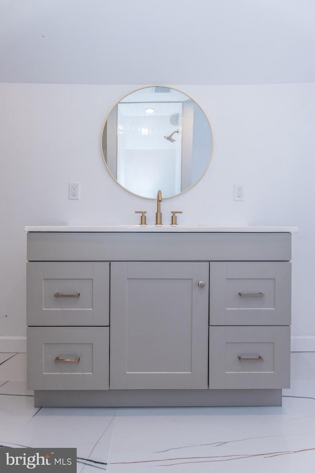 bathroom featuring vanity and baseboards