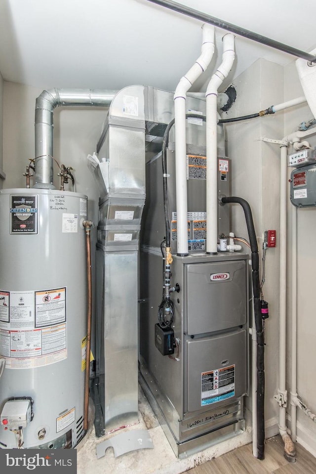 utility room with gas water heater