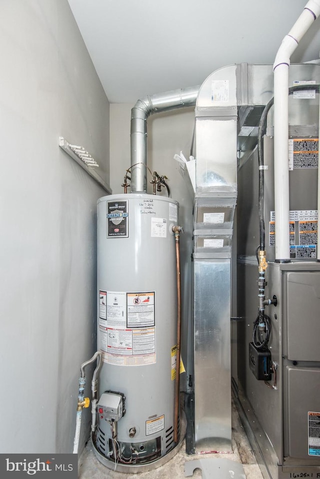 utility room featuring gas water heater