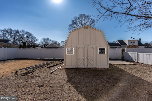 view of shed with a fenced backyard