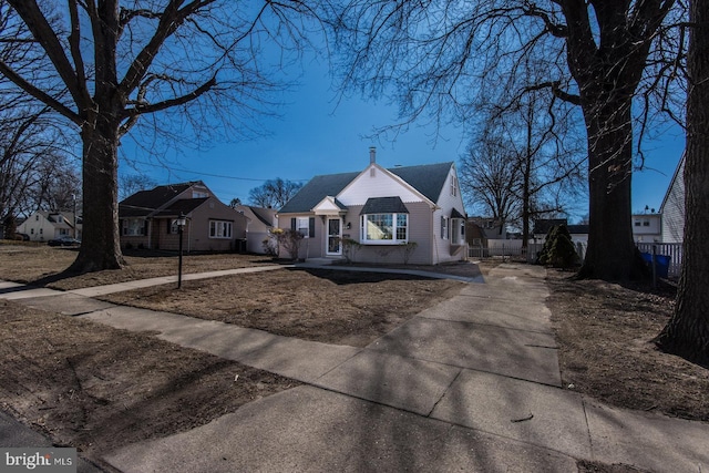 view of front of house featuring fence