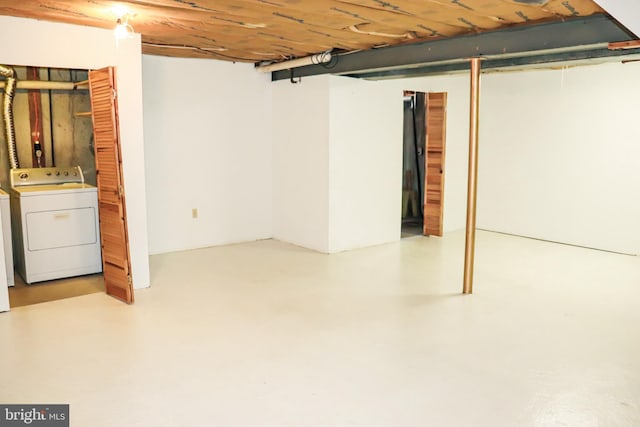 unfinished basement with washer / clothes dryer