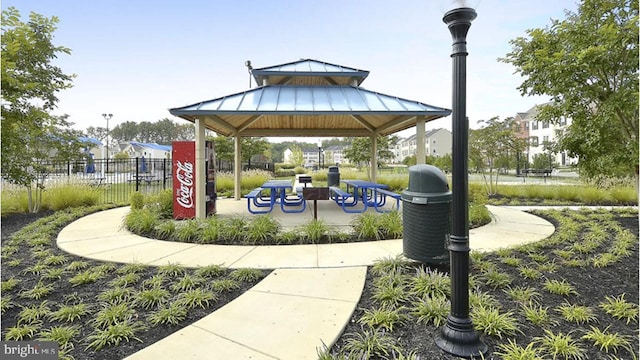 view of community with fence and a gazebo