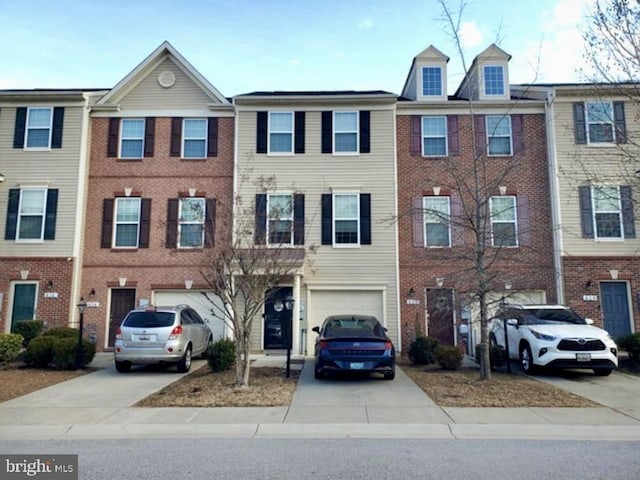 view of property with driveway and an attached garage