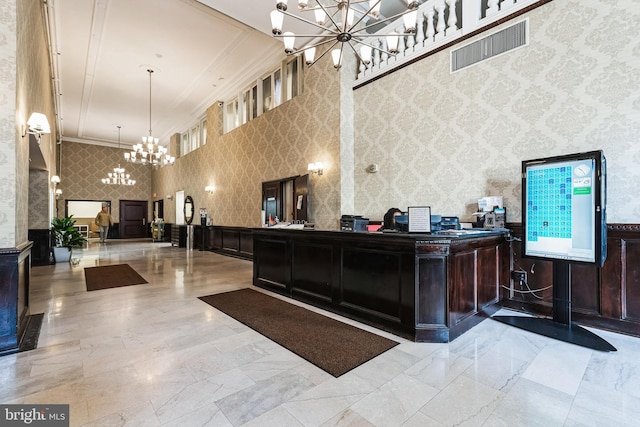 reception area featuring an inviting chandelier and visible vents