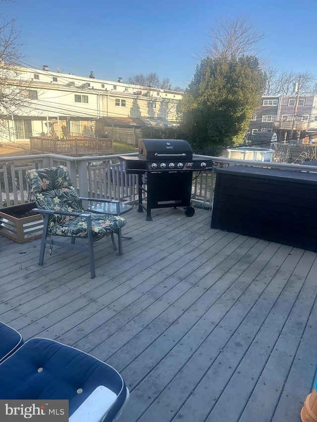 deck featuring fence and area for grilling