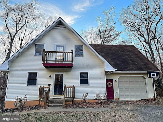 view of front of house with a balcony and a garage