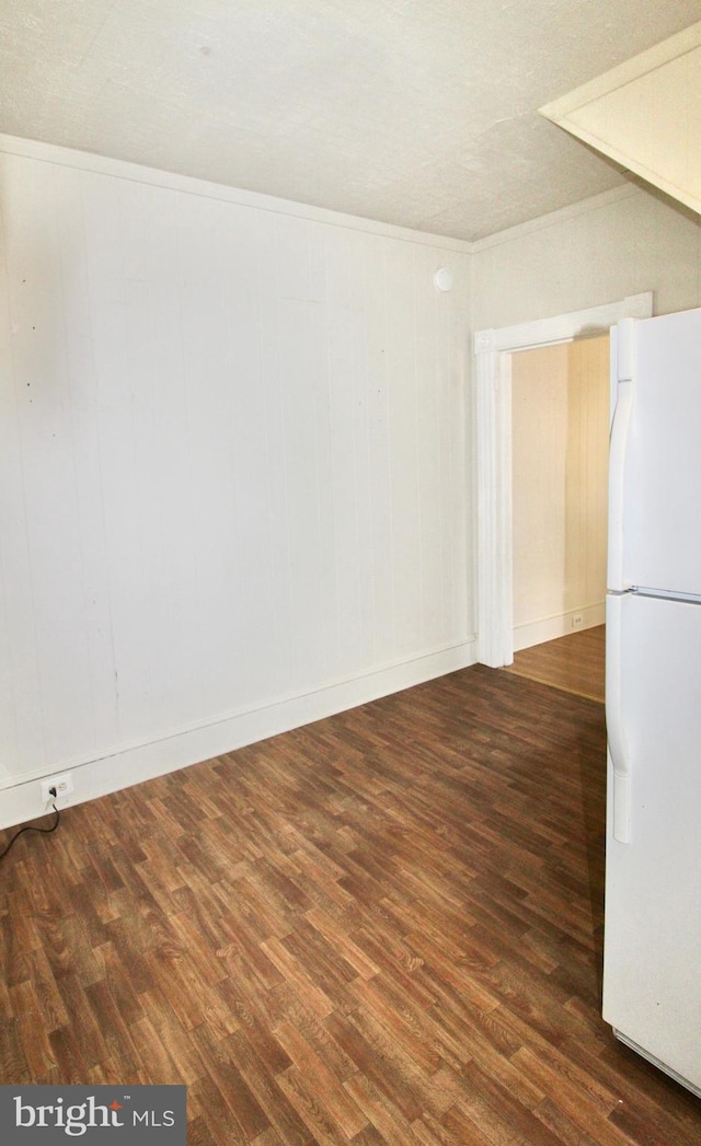 spare room with wood finished floors