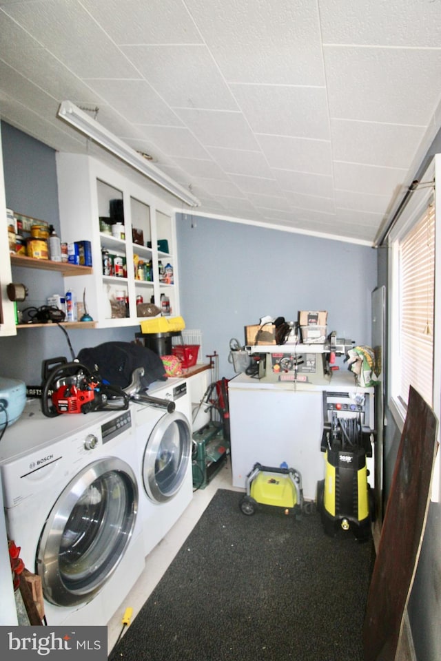 washroom featuring laundry area and washing machine and clothes dryer