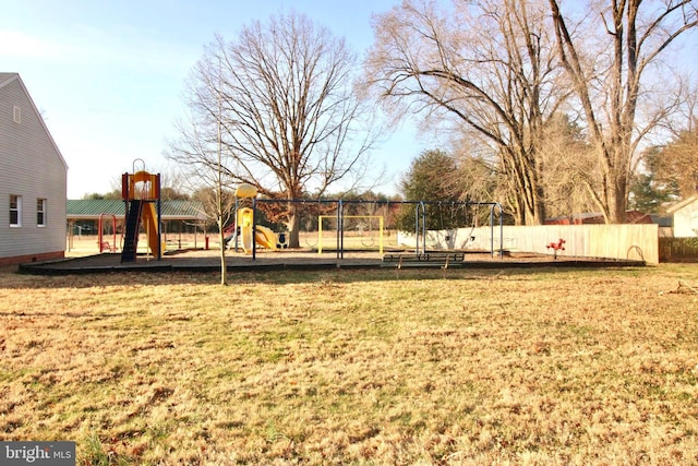 view of yard with fence and playground community