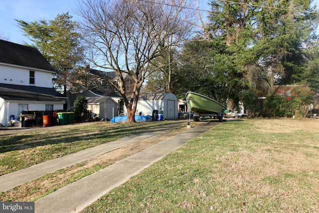 view of yard featuring an outbuilding and a storage shed