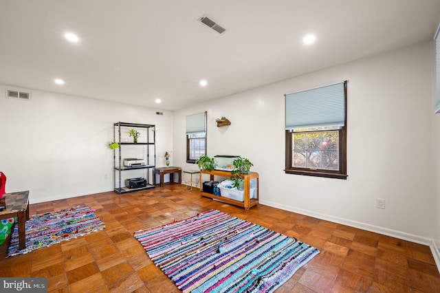 interior space featuring baseboards, visible vents, and recessed lighting