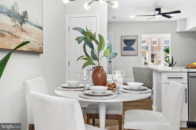 dining space featuring ceiling fan and wood finished floors