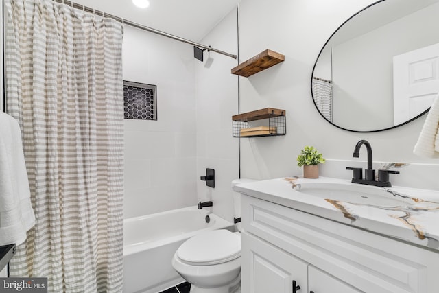 bathroom featuring toilet, vanity, and shower / bathtub combination with curtain