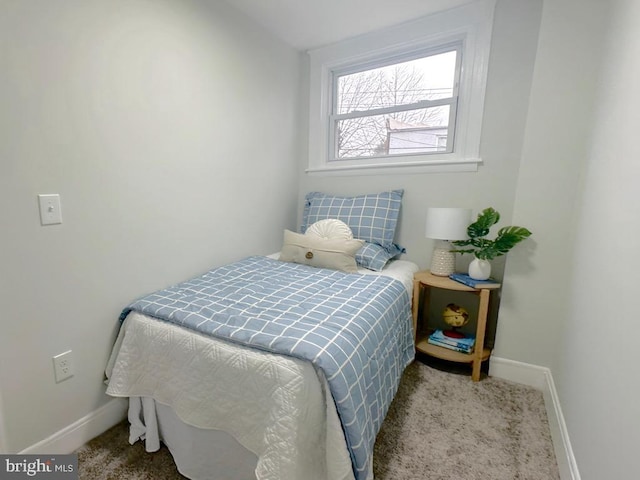 carpeted bedroom with baseboards