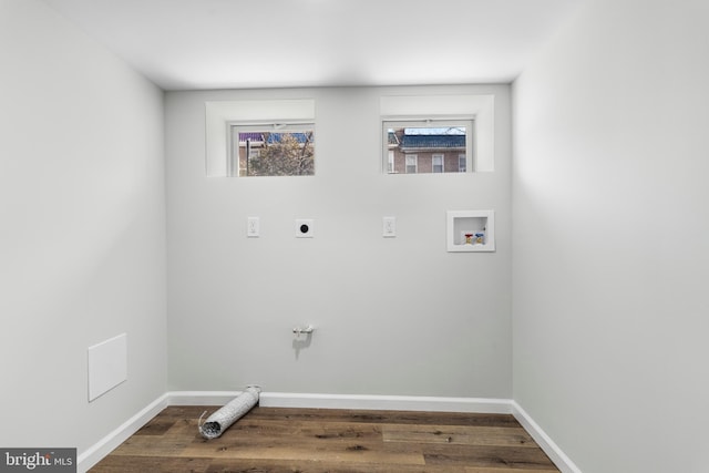 clothes washing area featuring laundry area, washer hookup, plenty of natural light, and electric dryer hookup