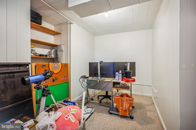 office space featuring carpet floors, baseboards, and a paneled ceiling