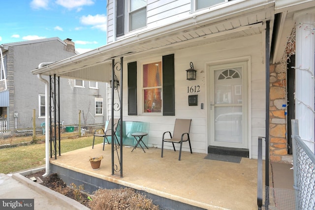 doorway to property with covered porch