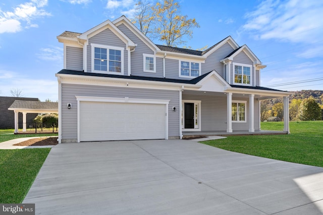 view of front of home featuring an attached garage, a porch, concrete driveway, and a front yard