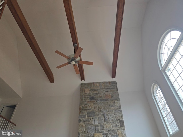 details with beamed ceiling and a ceiling fan